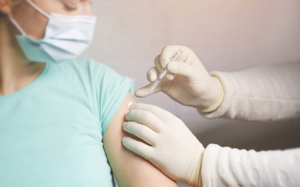 Woman receiving a vaccination