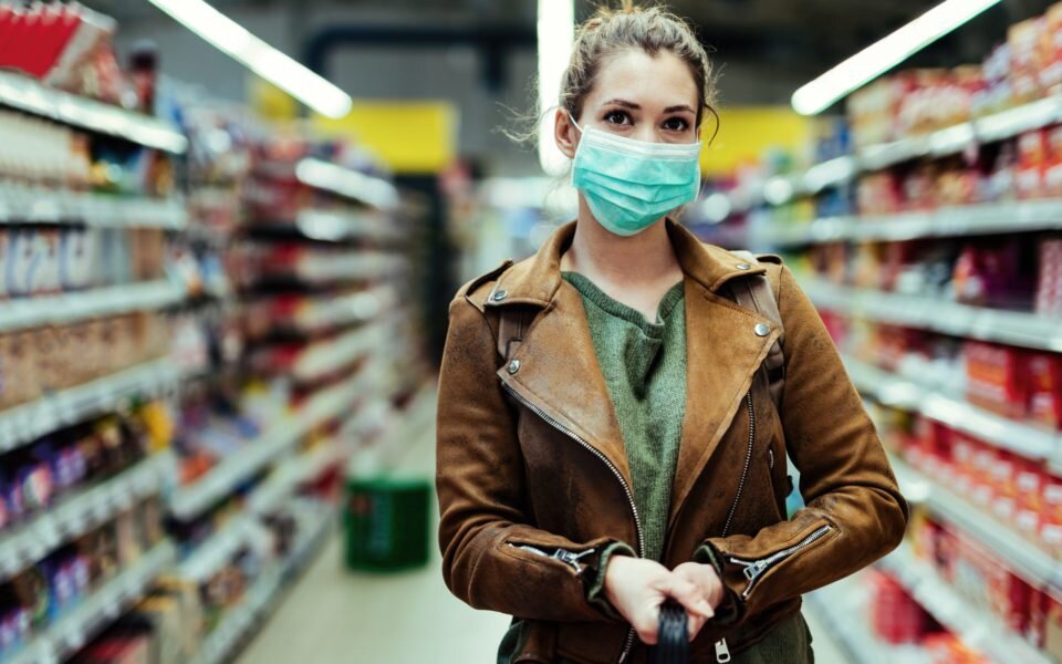 woman going shopping wearing a face covering