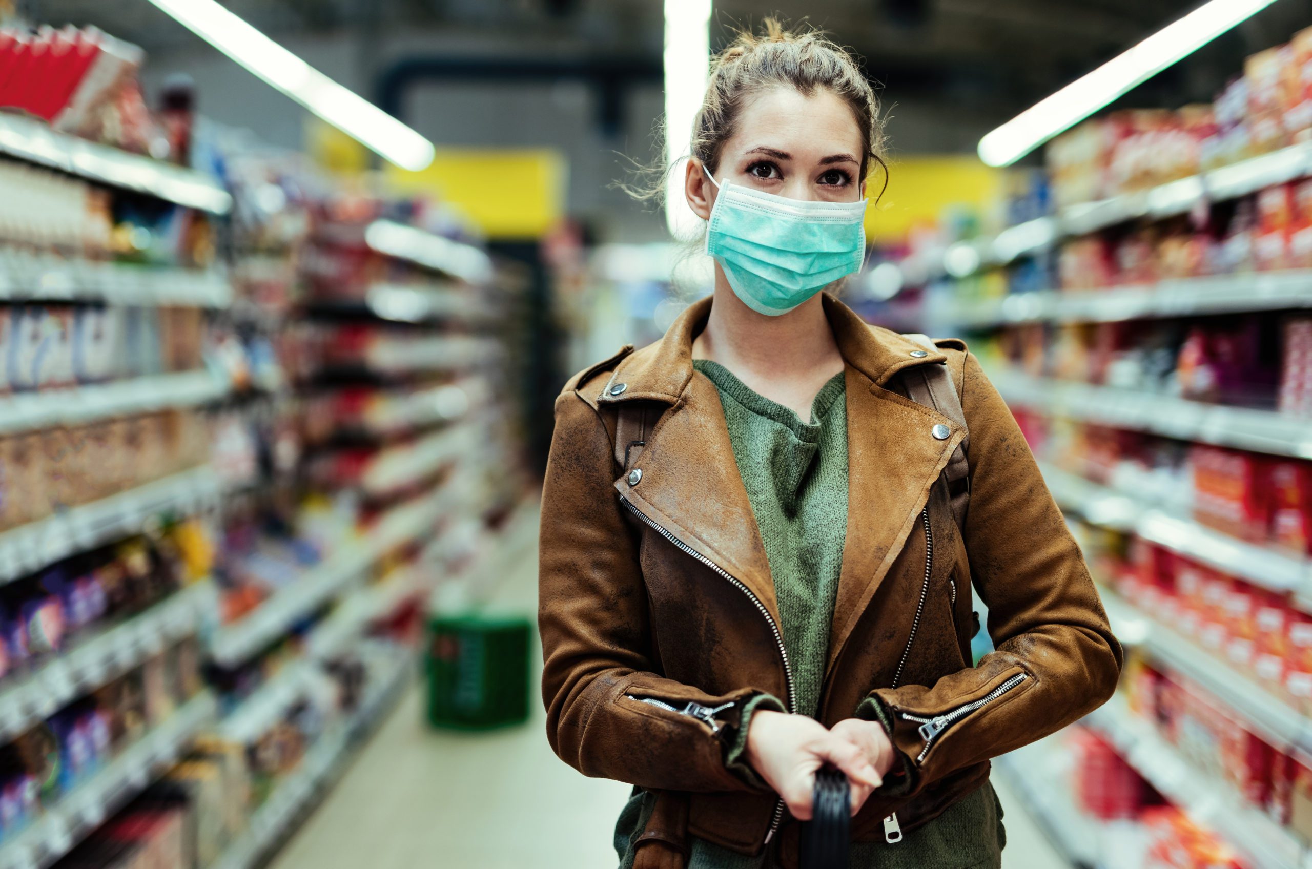 woman going shopping wearing a face covering