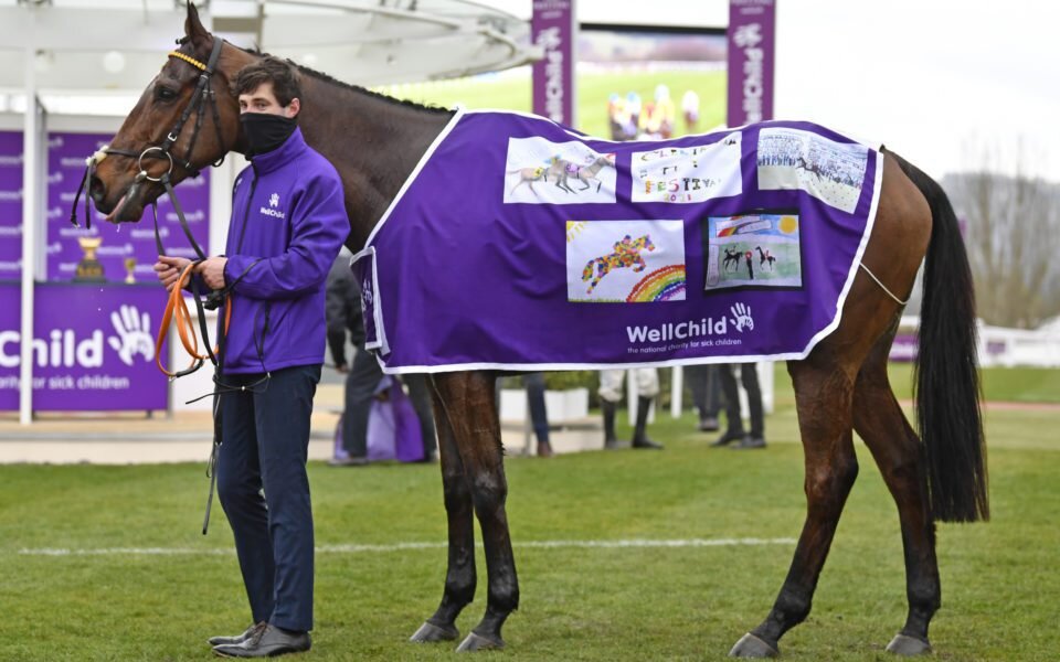 Minella Indo wearing a purple coat featuring winning drawings