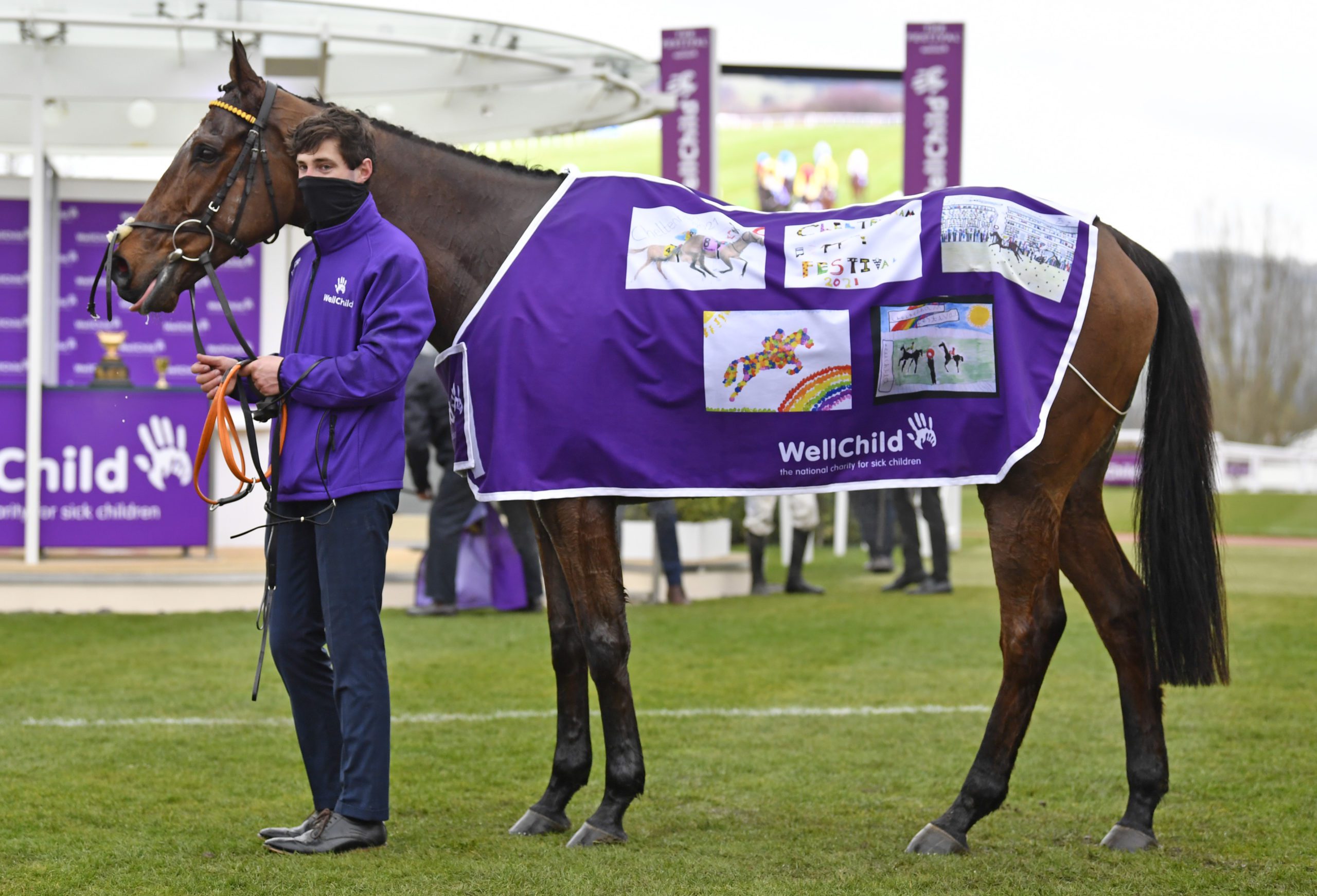 Minella Indo wearing a purple coat featuring winning drawings