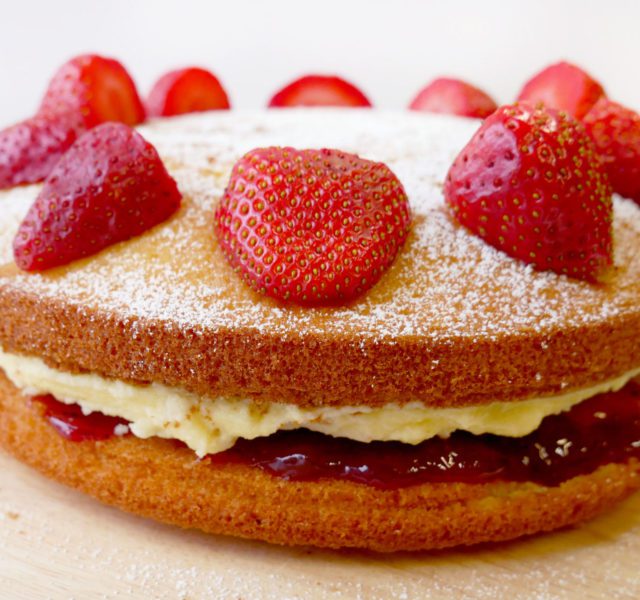 victoria sponge cake with strawberries on top