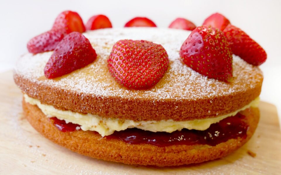 victoria sponge cake with strawberries on top