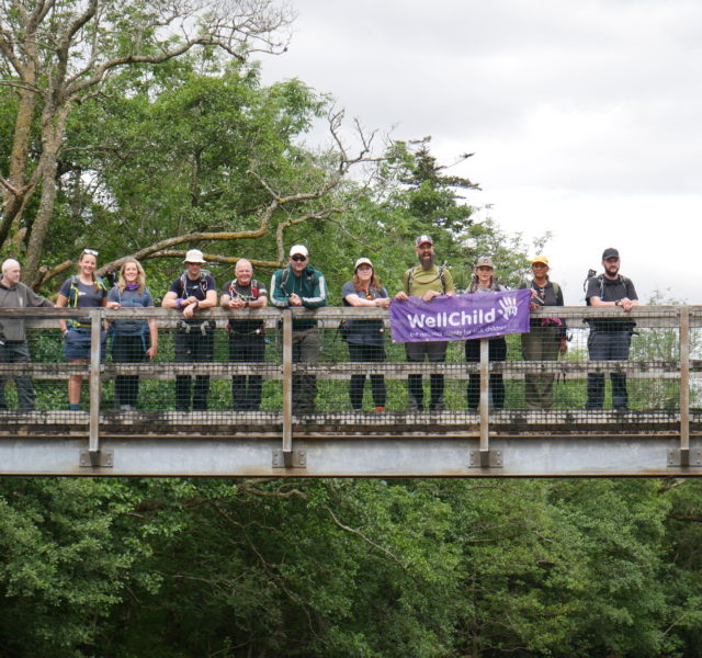Three Peaks Challenge participants on a bridge