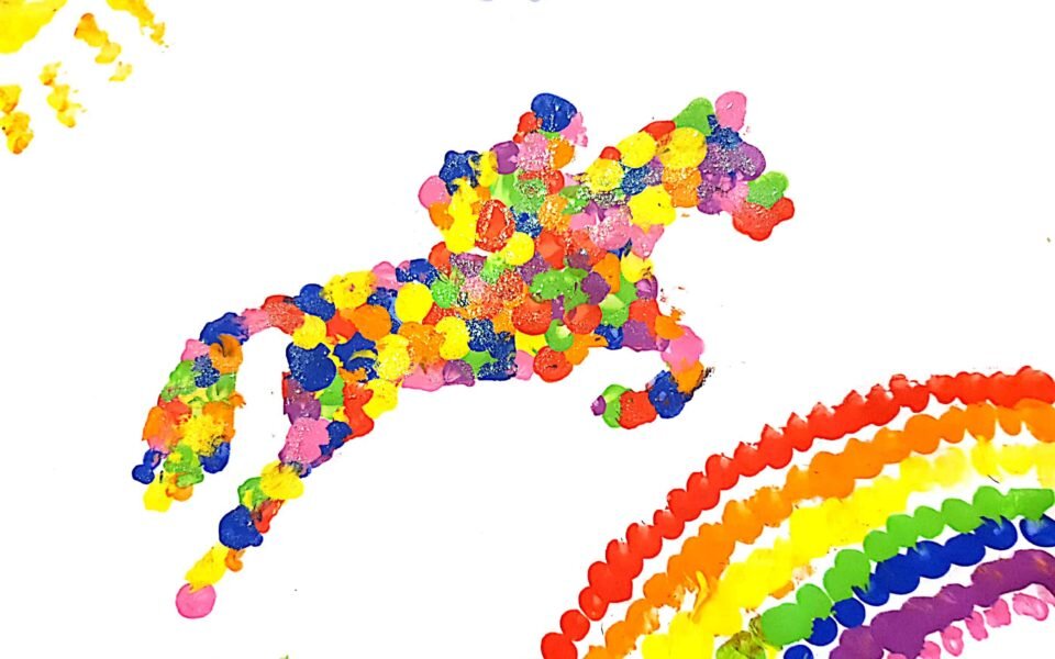 Toby's winning drawing of a jockey and horse jumping over a rainbow