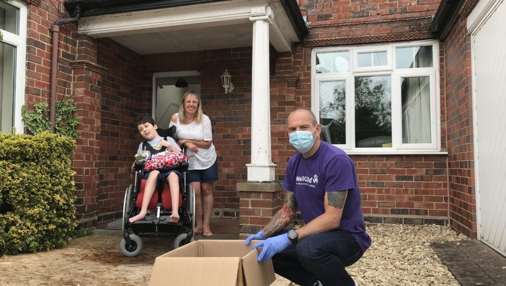 WellChild staff member distributes PPE