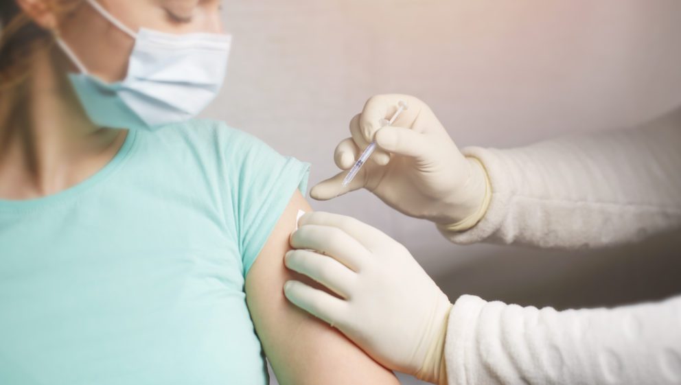 Woman receiving a vaccination