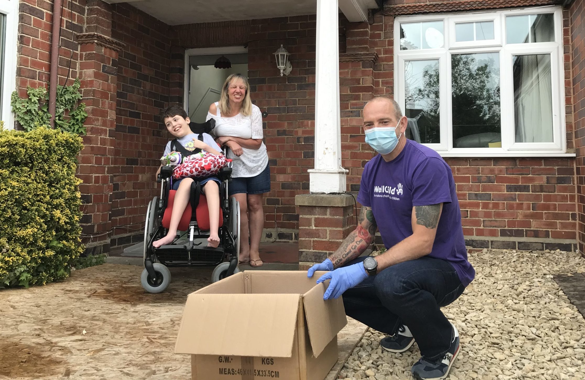 WellChild member of staff delivering PPE to a family