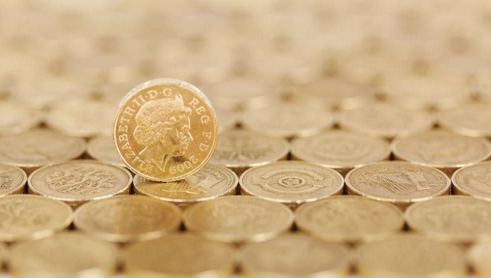 lots of pound coins, money