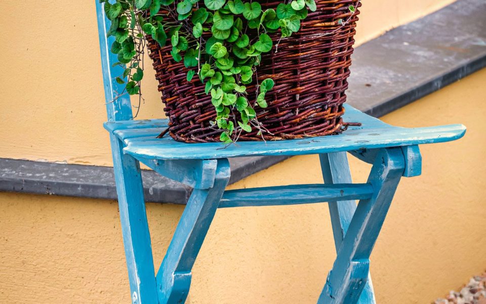 Blue garden chair, orange background