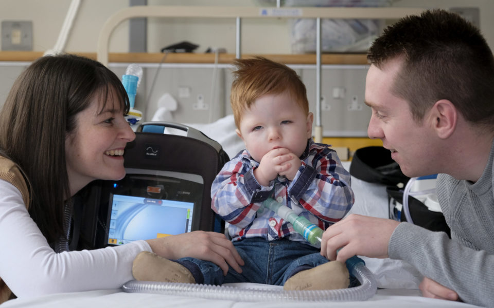 Rogan with his parents Rachel and Wayne