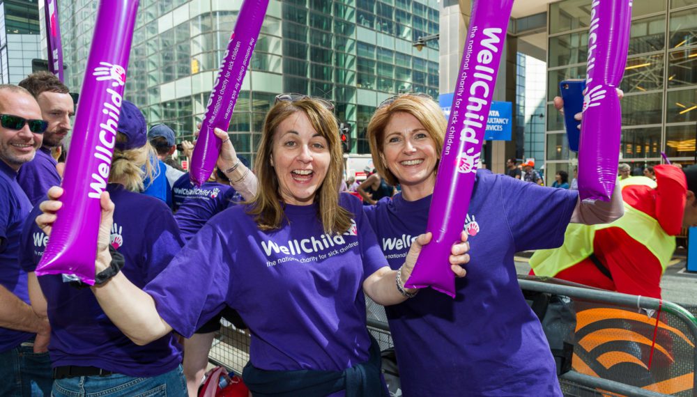 Two volunteers with cheer stick at the London Marathon