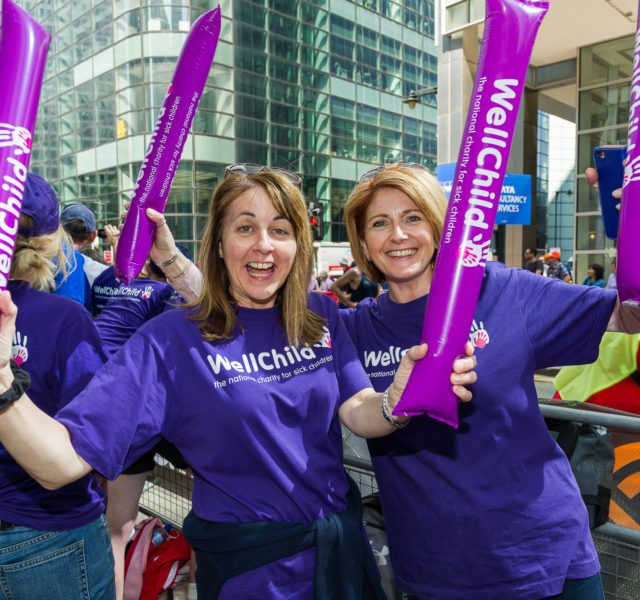 Two volunteers with cheer stick at the London Marathon