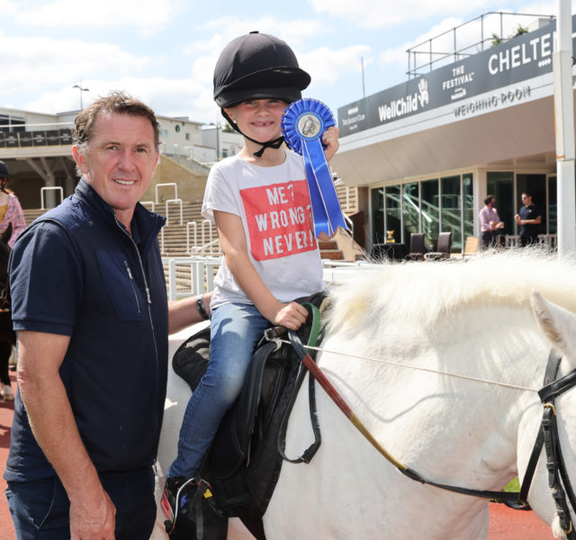 AP McCoy with young girl sat on a pony