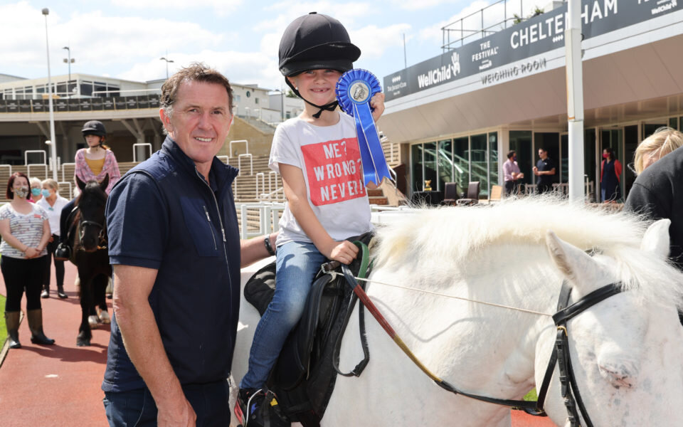 AP McCoy with young girl sat on a pony