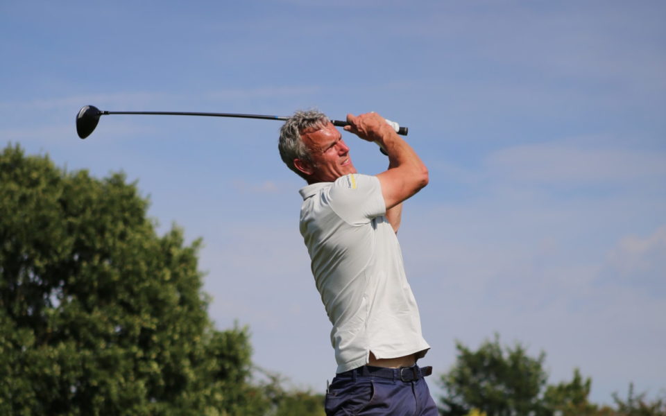 Mark Foster playing golf