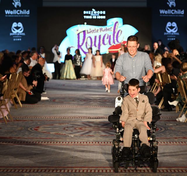 Ollie and his dad on the catwalk at the Icon event