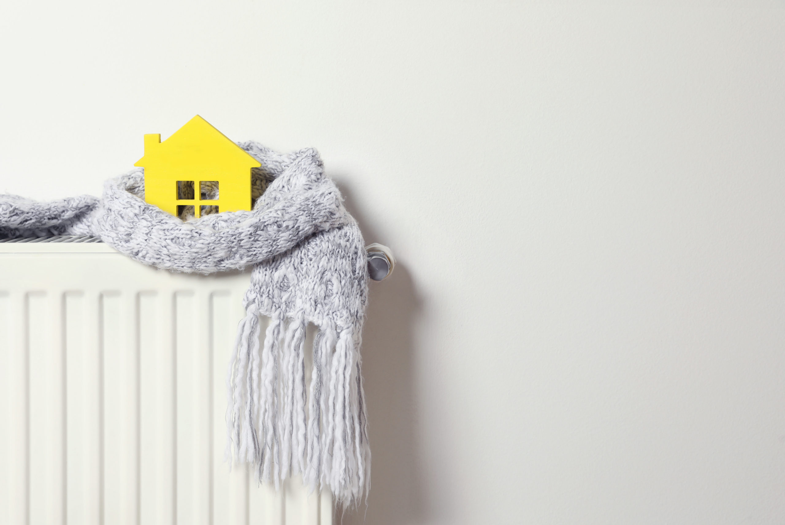 house wrapped in a scarf on a radiator