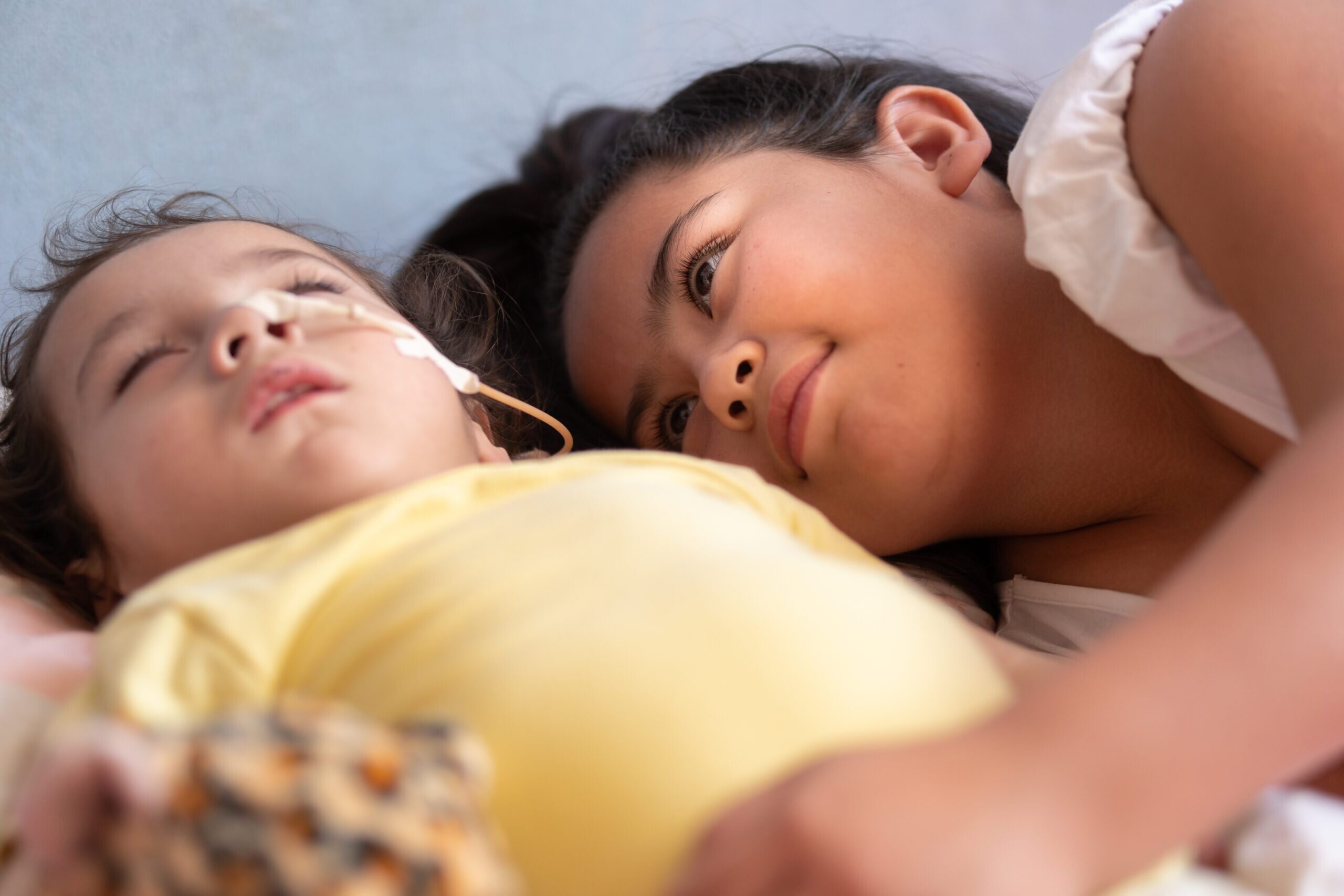 mother laying with sleeping child