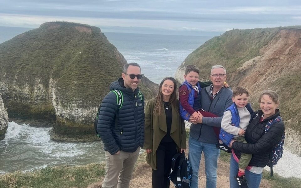 Family enjoying a coastal hike together.